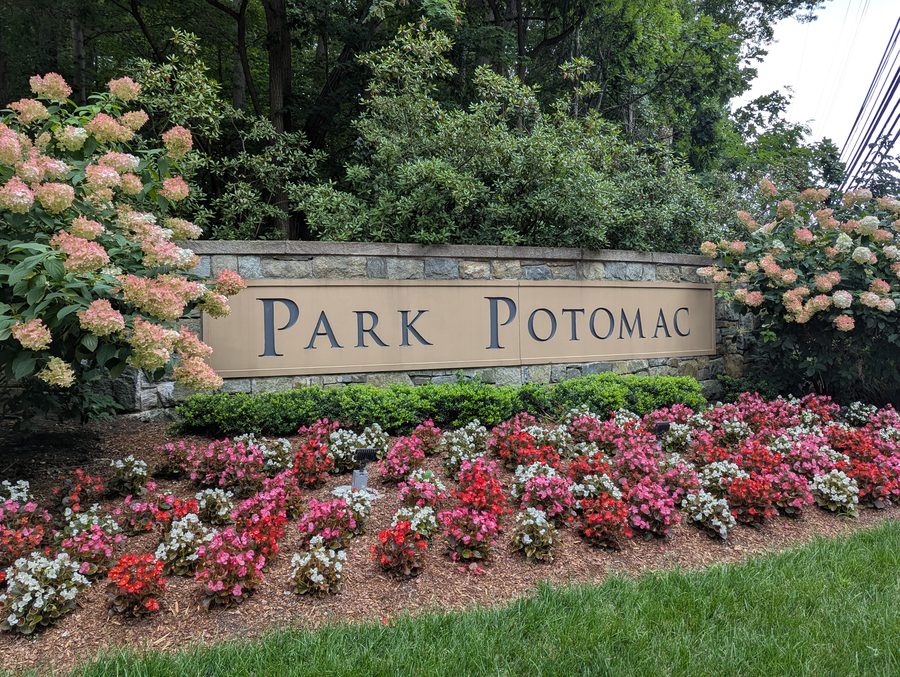 Park Potomac entrance sign surrounded by flowers